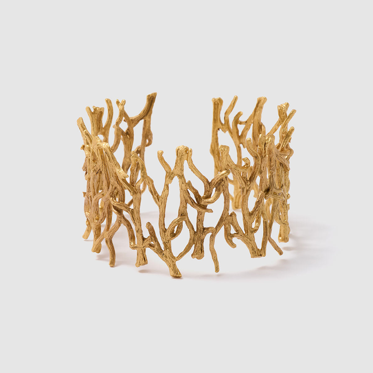 Enchanted Forest, A beautifully crafted bronze cuff bracelet that resembles intertwining branches, showcasing nature's organic beauty.
Available in silver, gold, and black finishes.