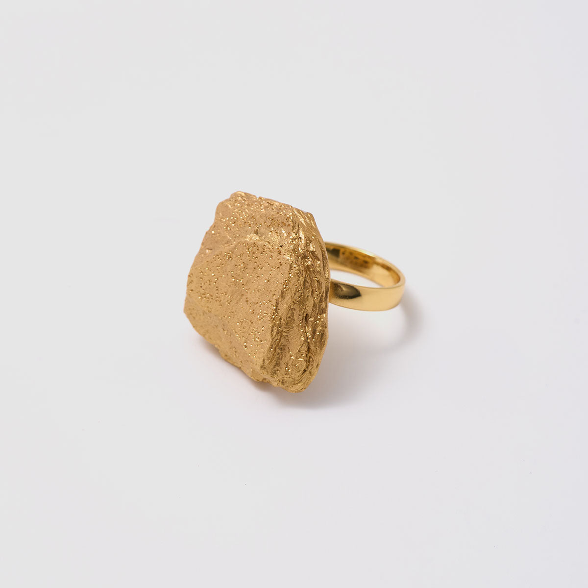 Golden Delights, A standout textured ring in bronze that highlights its unique form, perfect for those who appreciate bold and artistic designs.