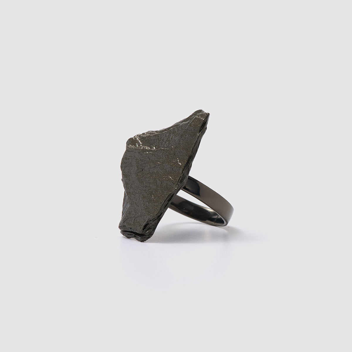 Raw Elegance, Striking sculptural ring crafted from bronze that embraces raw elegance with its unique form.