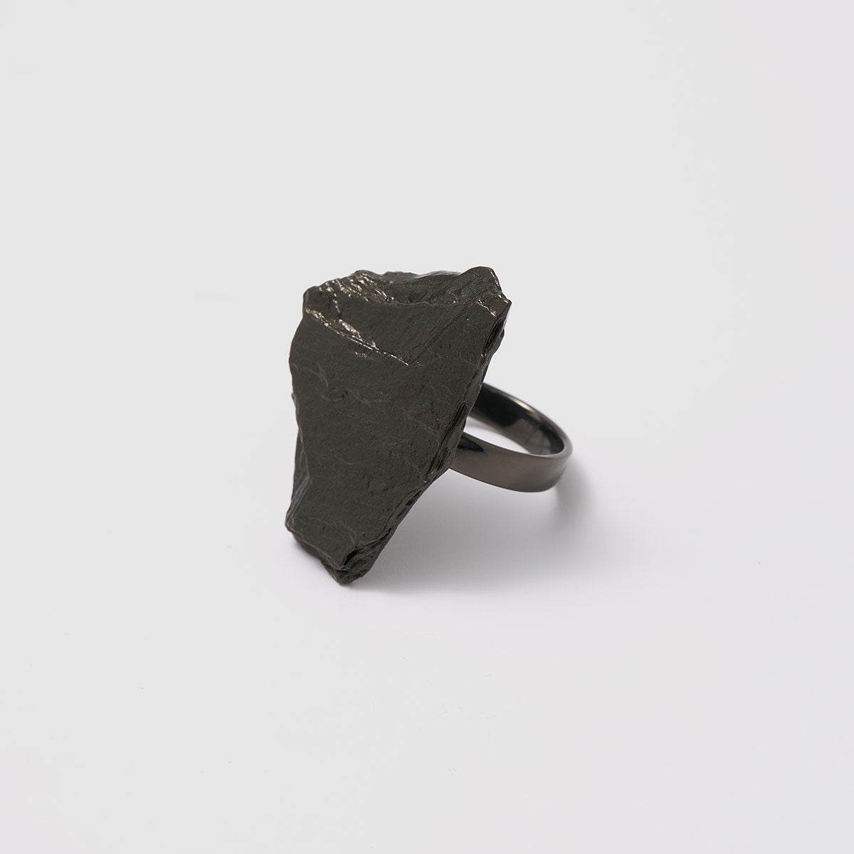 Raw Elegance, Striking sculptural ring crafted from bronze that embraces raw elegance with its unique form.