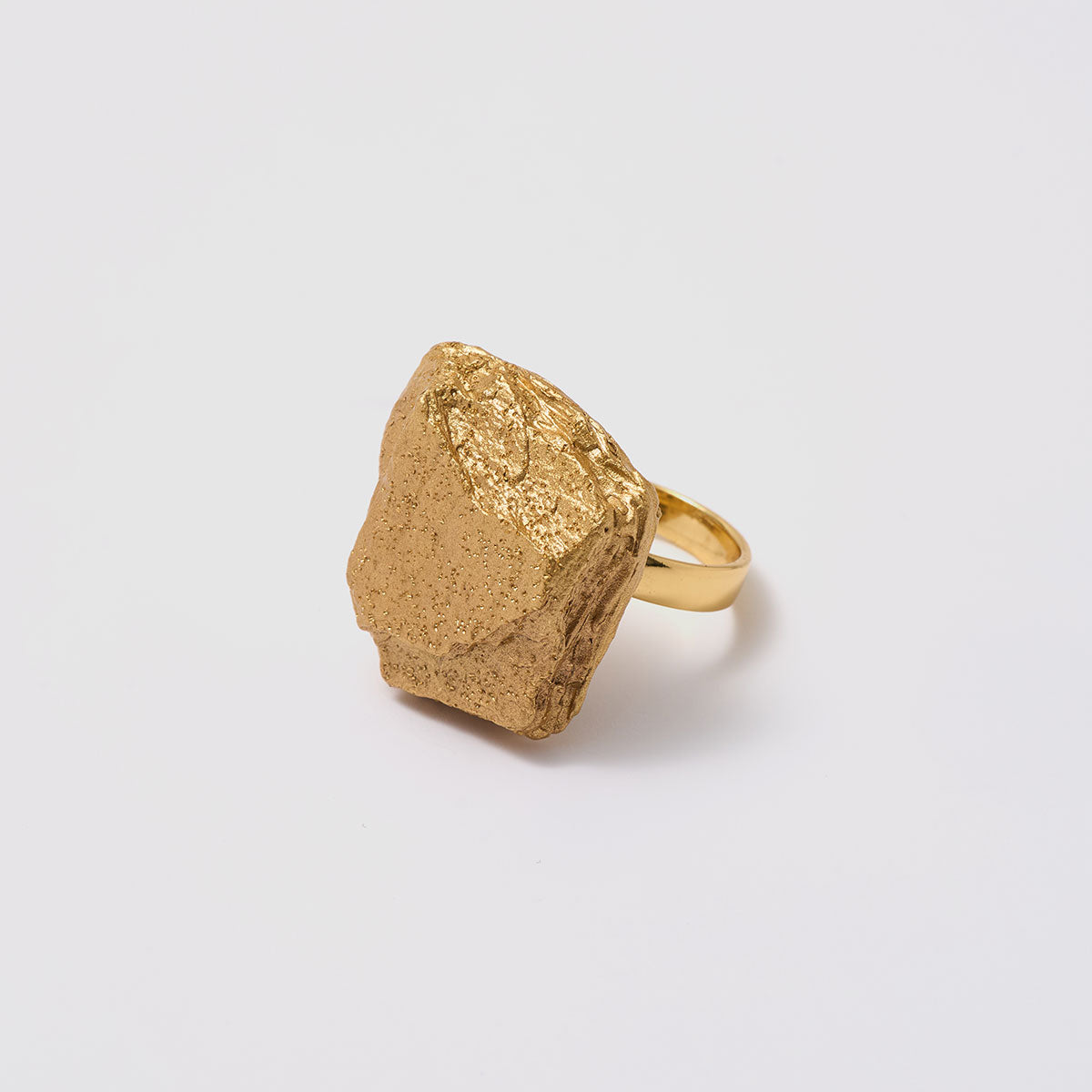 Golden Delights, A standout textured ring in bronze that highlights its unique form, perfect for those who appreciate bold and artistic designs.