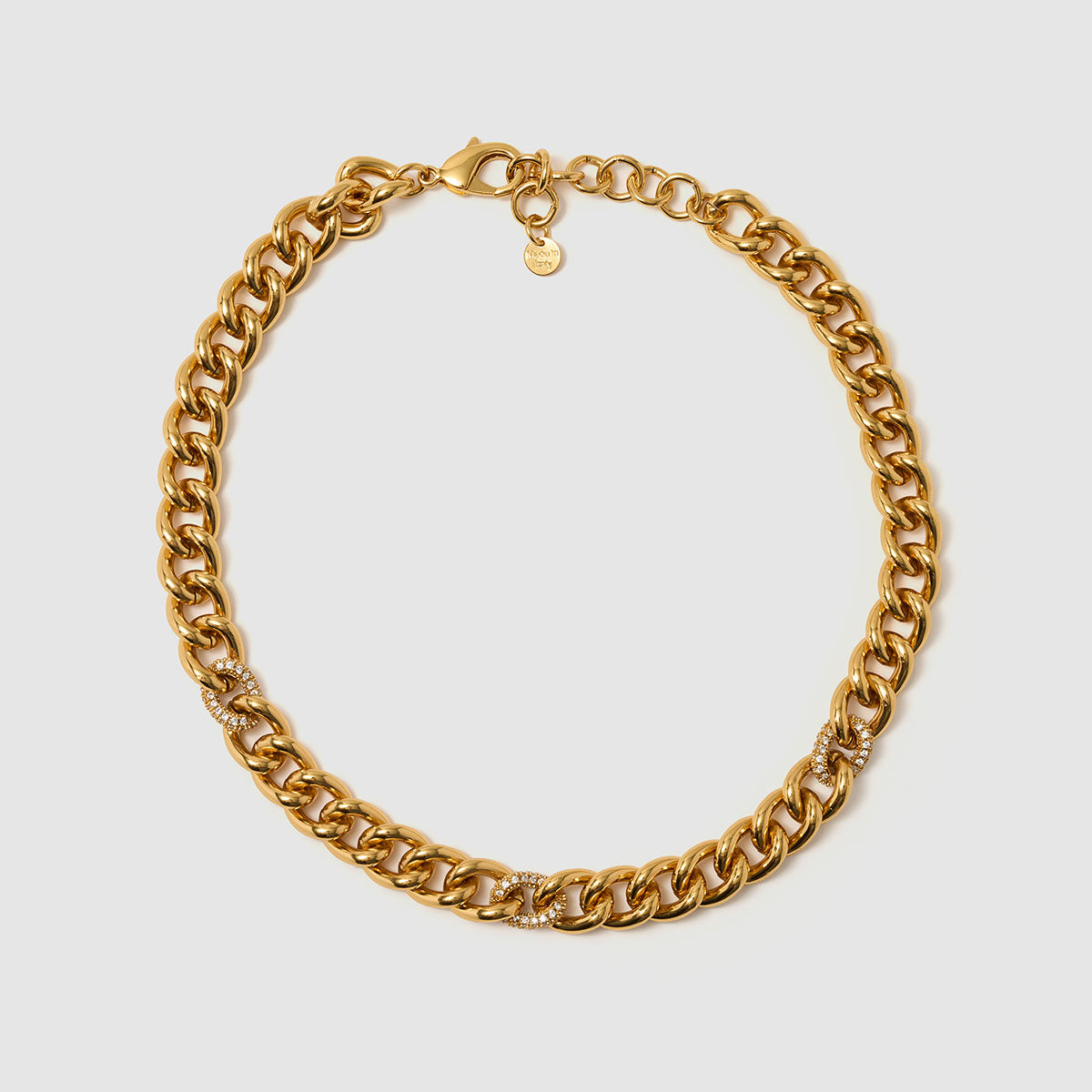 Venetian Chains, Timeless classic chain necklace featuring bold brass links enhanced with sparkling zircon details.