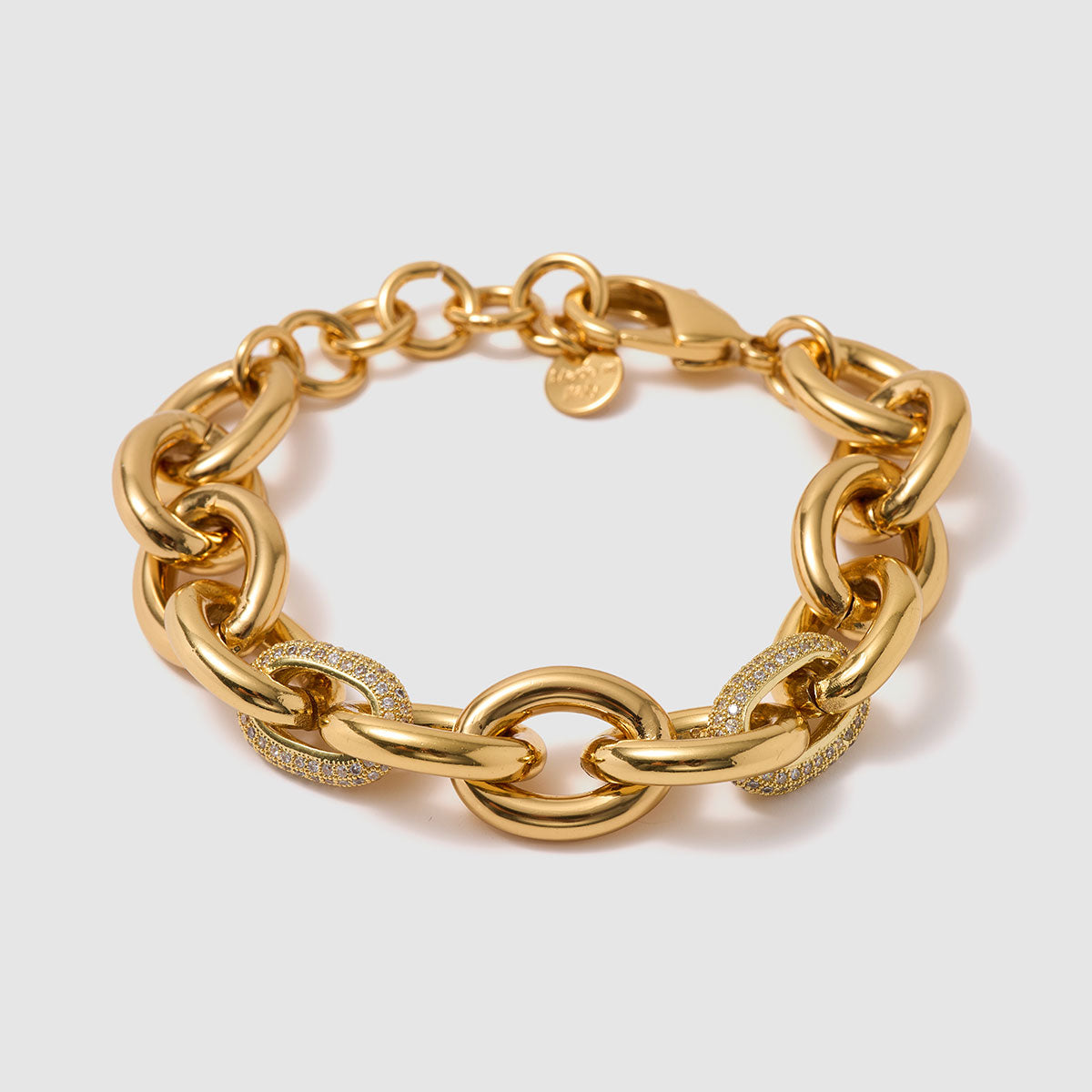 Charmed Voyage, Striking chain bracelet with bold brass links and sparkling zircon details.