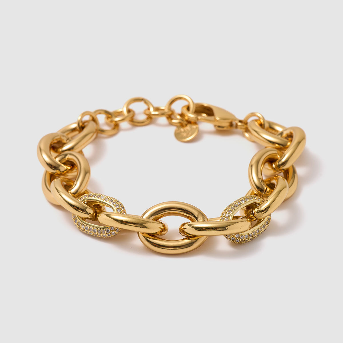 Charmed Voyage, Striking chain bracelet with bold brass links and sparkling zircon details.