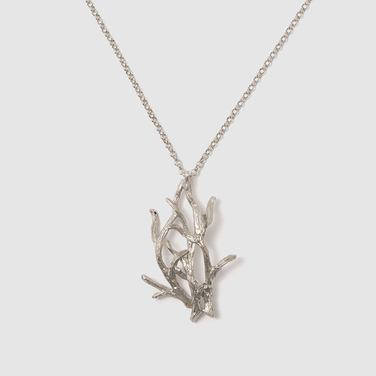 Enchanted Forest, A stunning pendant necklace showcasing a delicate botanical design, made from bronze to bring a touch of nature to your look.
Available in silver, gold, and black finishes.