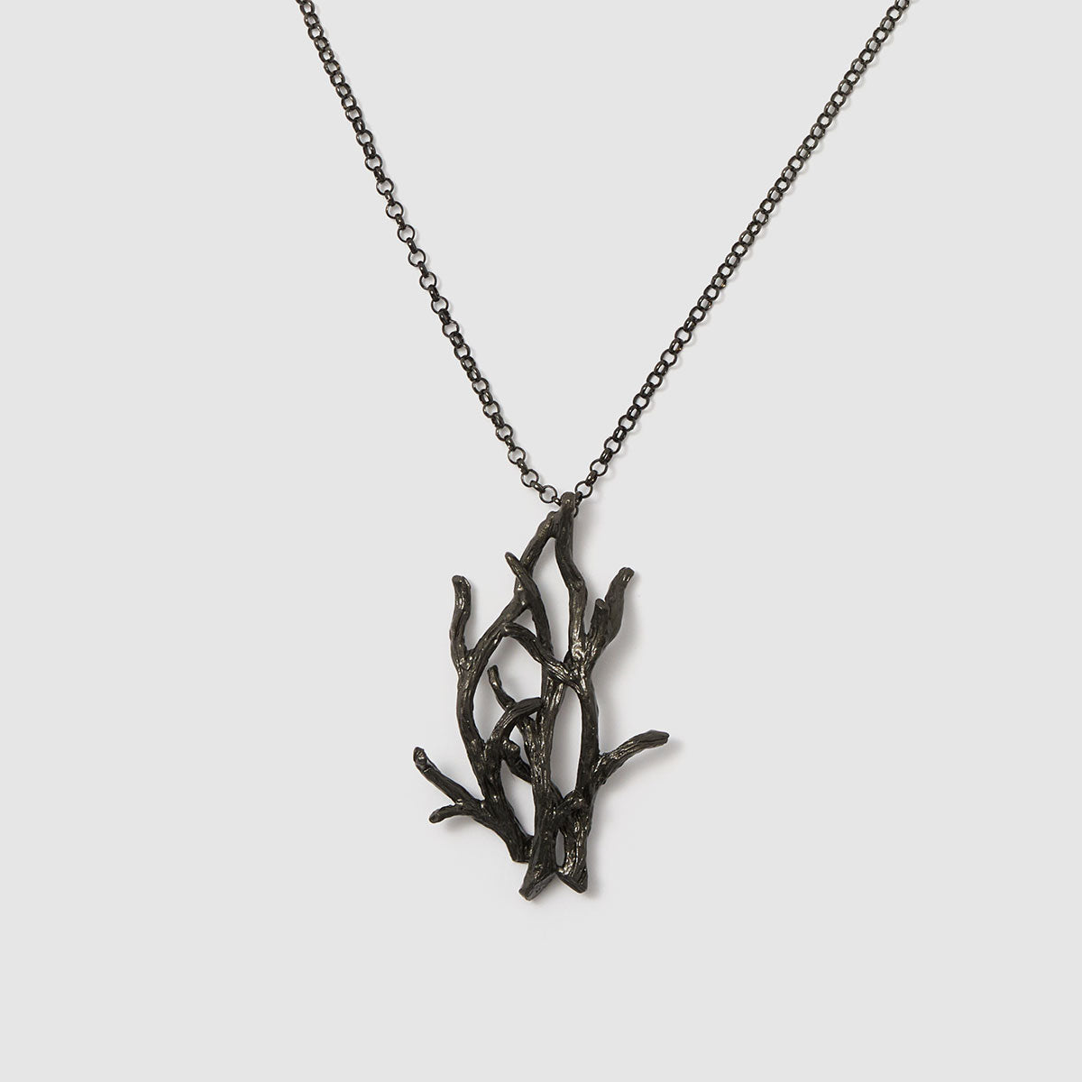 Enchanted Forest, A stunning pendant necklace showcasing a delicate botanical design, made from bronze to bring a touch of nature to your look.

Available in silver, gold, and black finishes.