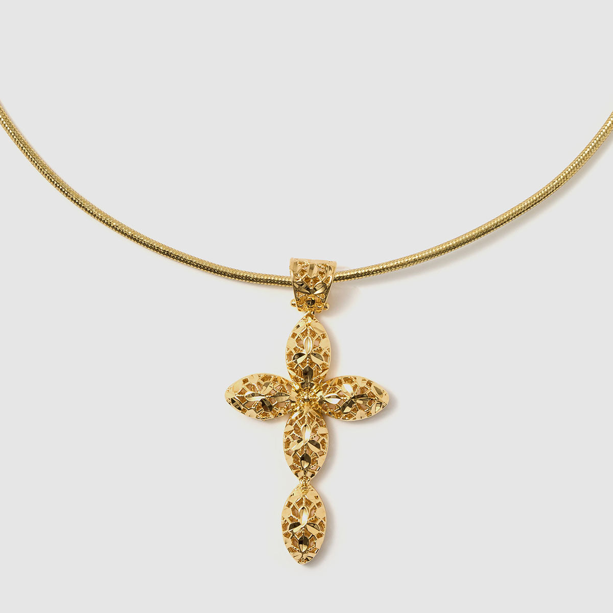 Crossroads of Time, A decorative cross pendant in black-tone bronze, featuring detailed artistry that merges modern style with spiritual significance.
Available in gold and black tones.