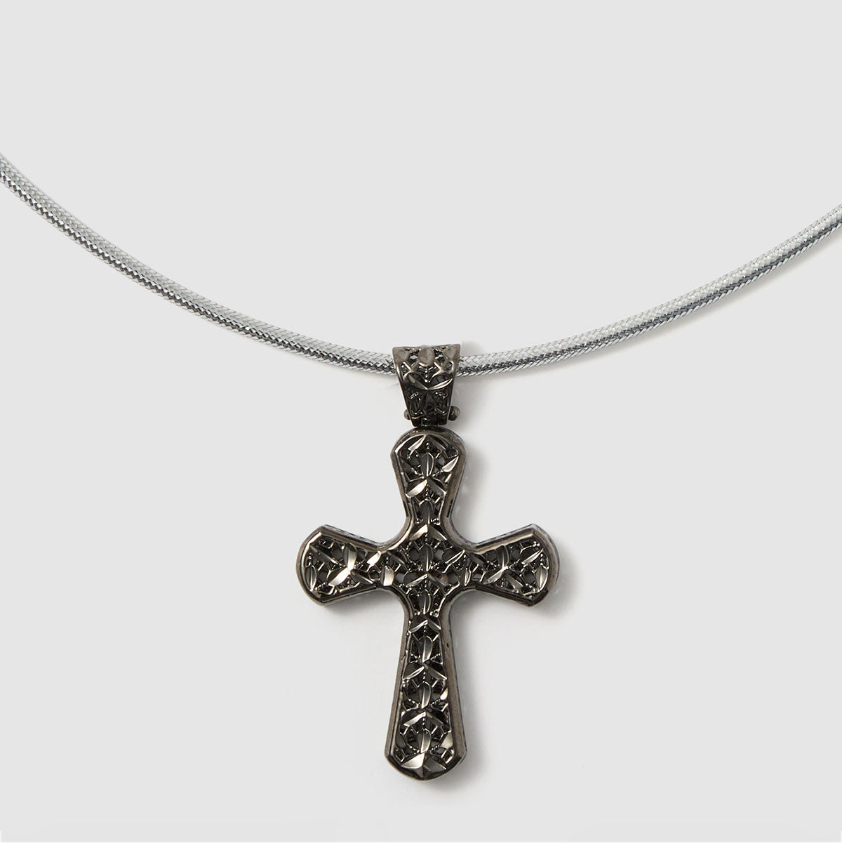 Crossroads of Time, A beautifully detailed textured cross pendant in bronze, adding depth and character to any outfit.
Available in gold and black tones.