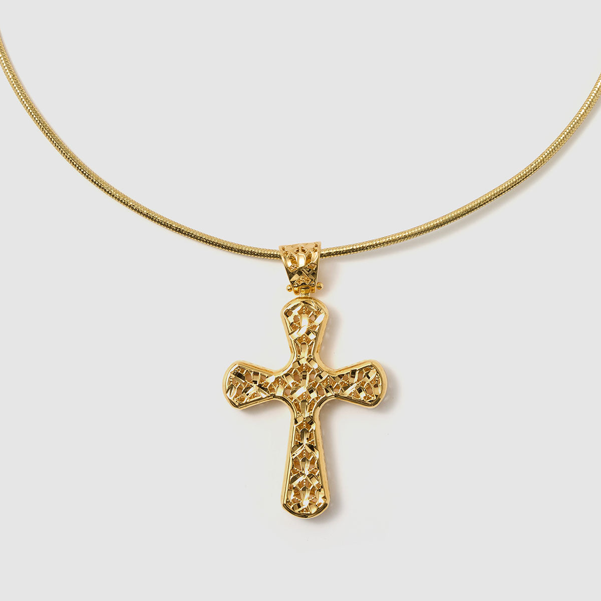 Crossroads of Time, A striking bronze cross pendant with a unique textured finish, merging tradition with a modern edge for a bold statement.
Available in gold and black tones.