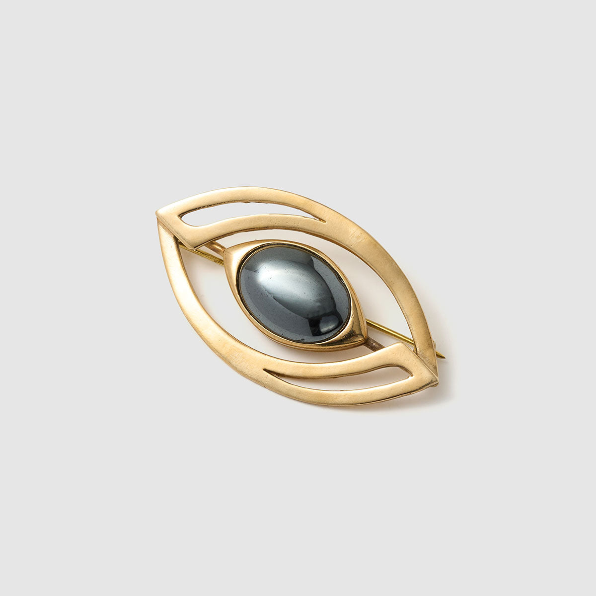 Mystic Vision, Striking brooch in the shape of an eye, crafted from bronze and aluminum with a fiber optic centerpiece.