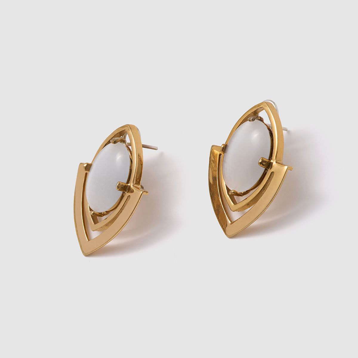 Harmony in Form, Sleek stud earrings featuring a bronze frame and luminous fiber optic cabochon.