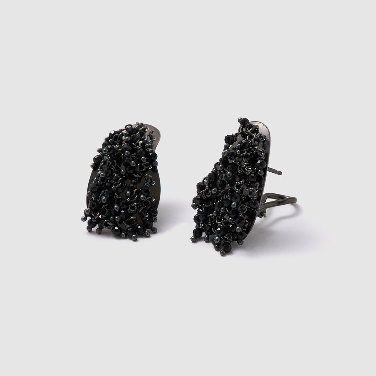 Nocturnal Charm, Striking stud earrings made from black galvanized bronze and adorned with intricate crystal beads.