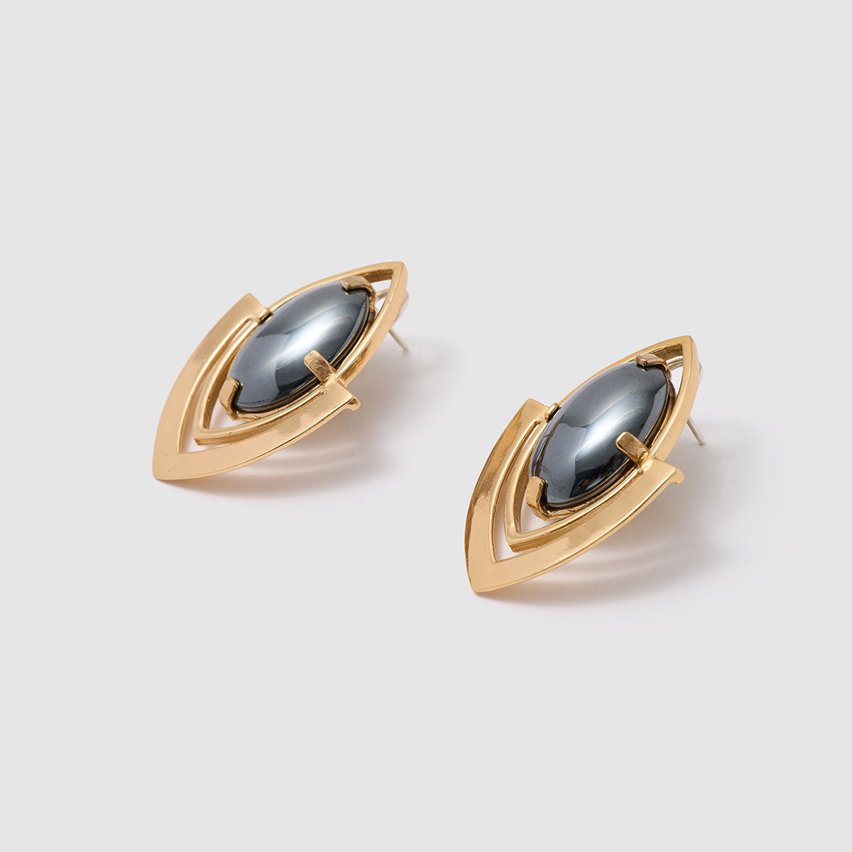 Mystic Vision, Elegant stud earrings featuring bronze frames and striking hematite cabochons.