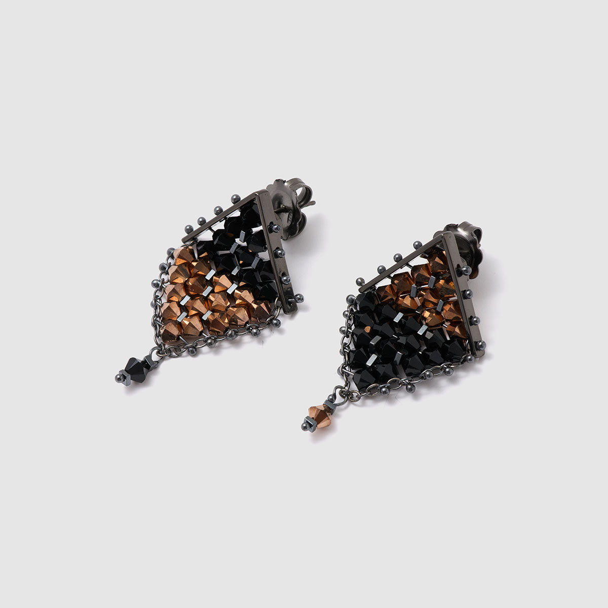 Dusk & Dawn, Eye-catching drop earrings featuring a unique geometric mesh design embellished with crystal beads and hematite flag cubes.