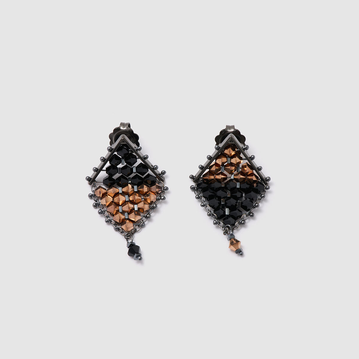 Dusk & Dawn, Eye-catching drop earrings featuring a unique geometric mesh design embellished with crystal beads and hematite flag cubes.