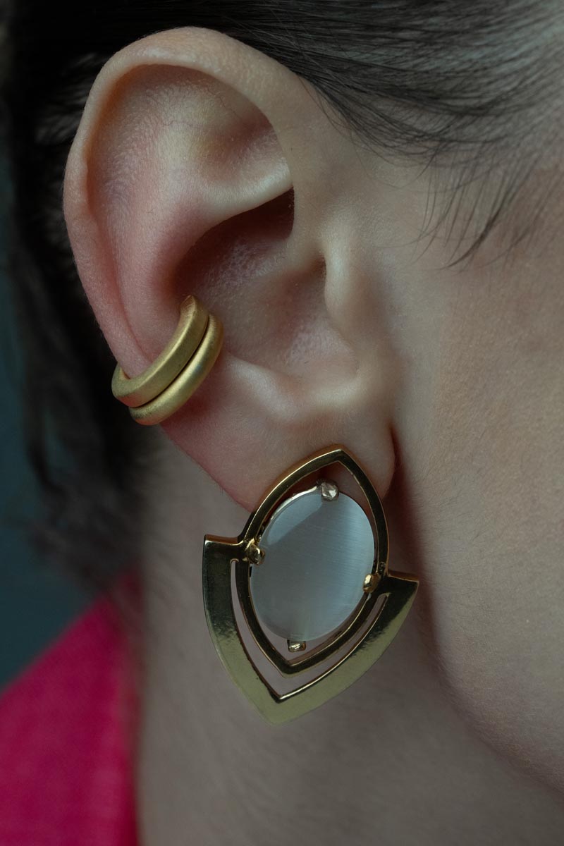 Harmony in Form, Sleek stud earrings featuring a bronze frame and luminous fiber optic cabochon.