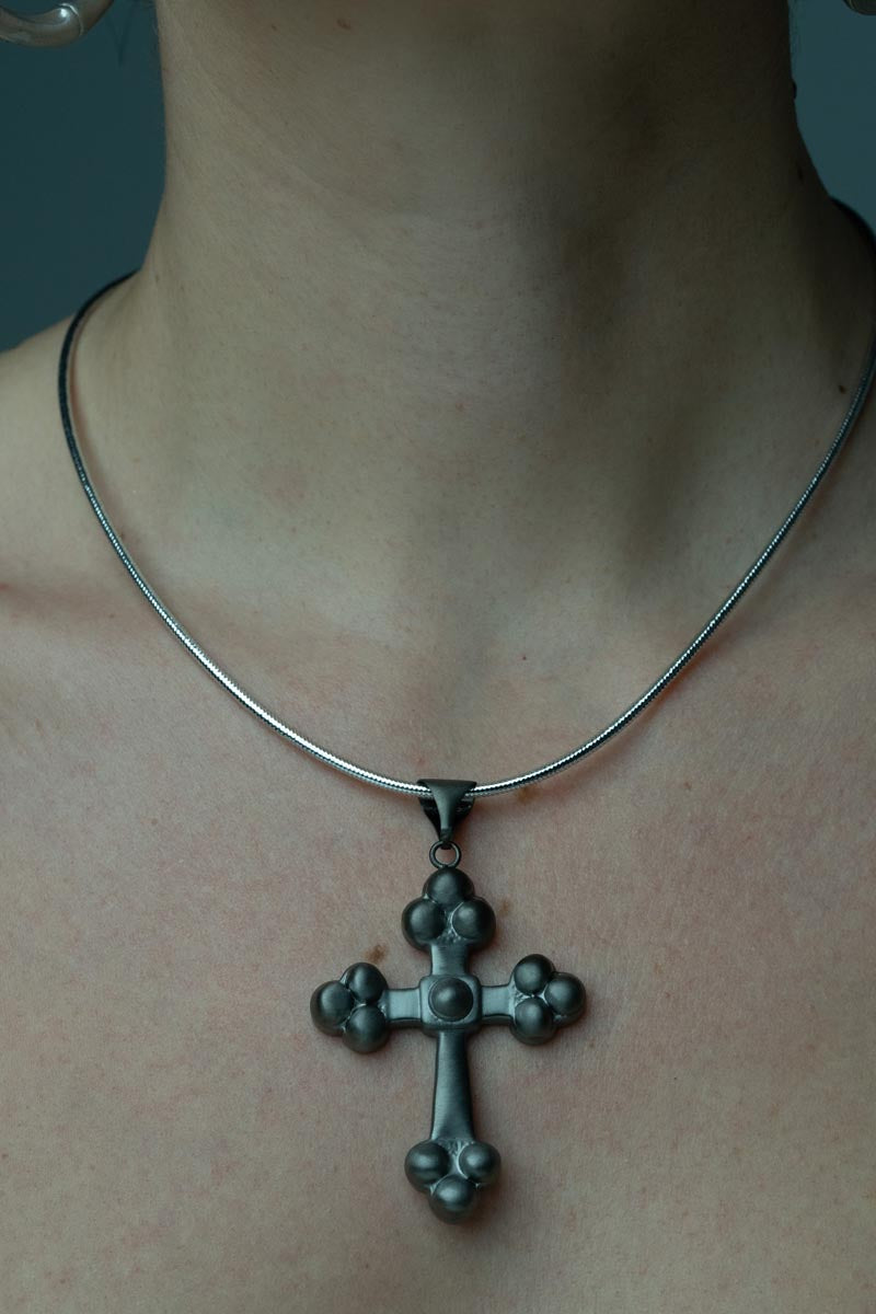 Crossroads of Time, An exquisite bronze cross pendant that beautifully embodies spirituality and style, ideal for layering with other pieces.
Available in black, gold and silver tones.