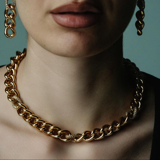 Venetian Chains, Timeless classic chain necklace featuring bold brass links enhanced with sparkling zircon details.