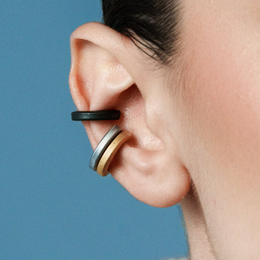 Chic Circulars, Polished bronze earcuffs that offer a sleek, sophisticated look, perfect for elevating any outfit.

Available in black, gold and silver tones.